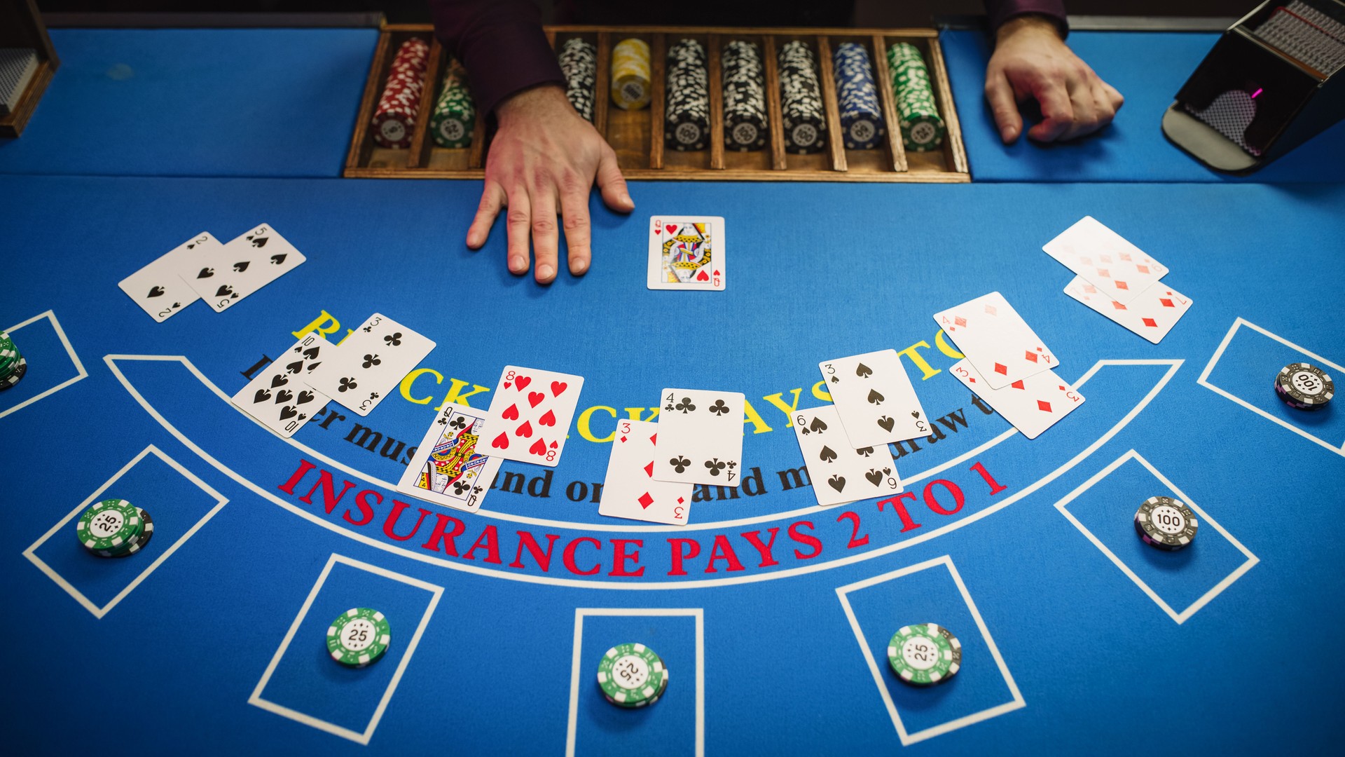 Top View Shot of a Online Casino Card Game Table: Anonymous Game Dealer Masterfully Revealing possible Jackpot Winning Hand. Blackjack Croupier Dealing Playing Cards. Top Down Shot